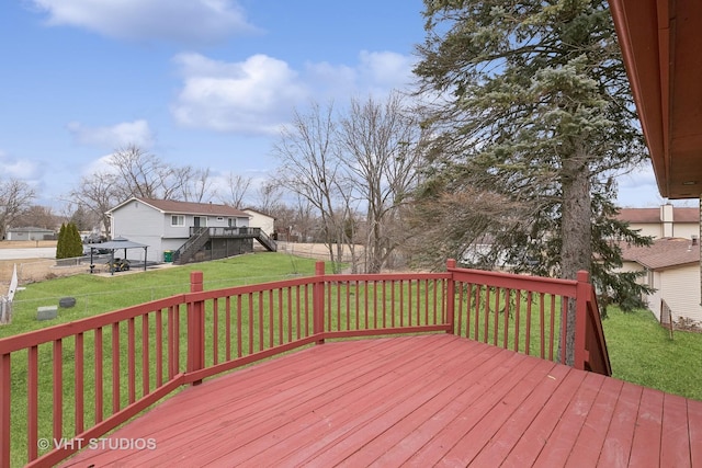 wooden terrace with a yard