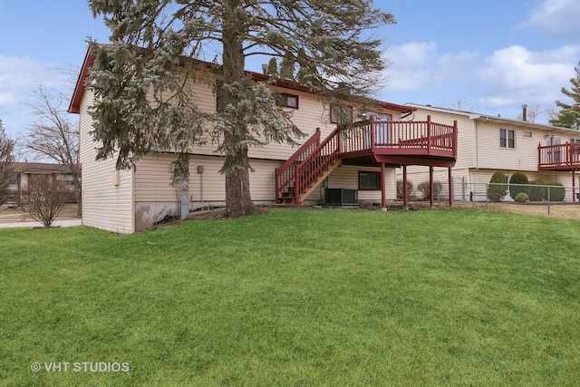 rear view of house with a yard, central AC, and a deck