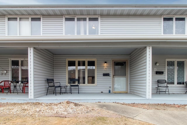 view of exterior entry with covered porch