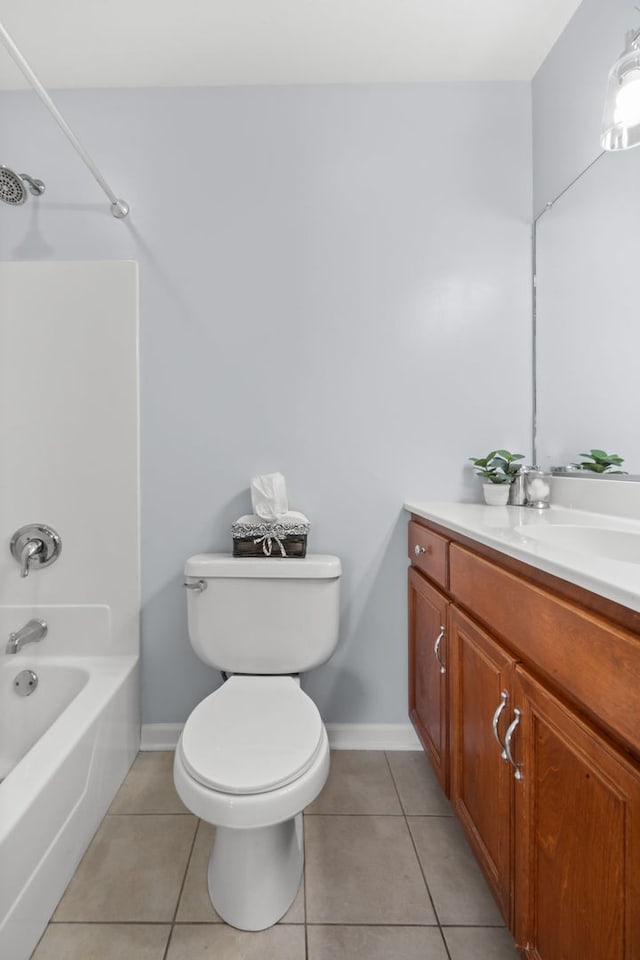 full bathroom featuring tile patterned floors, vanity, toilet, and shower / washtub combination