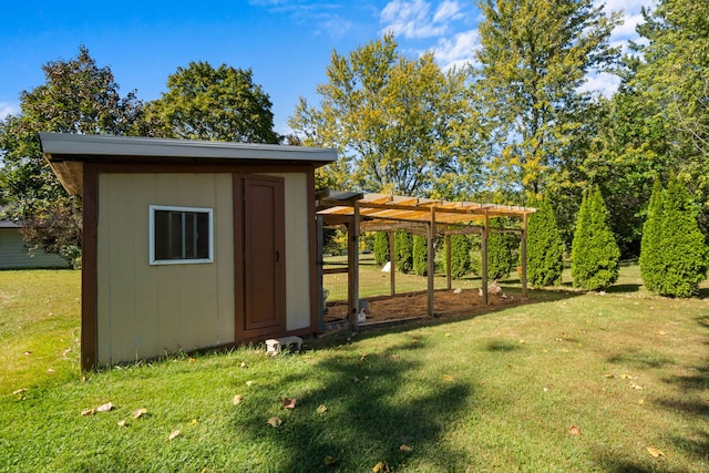 view of outdoor structure with a lawn