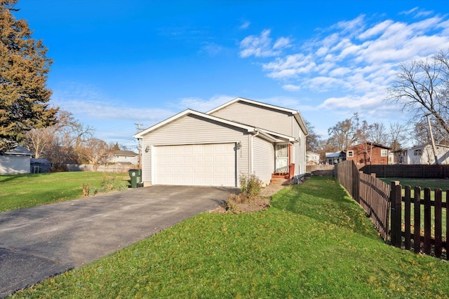 view of home's exterior with a yard and a garage