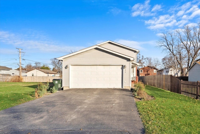 view of front of house with a front yard and a garage