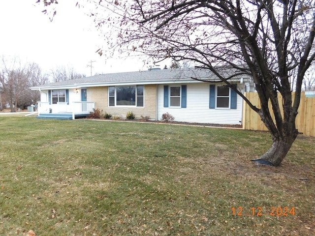 single story home with a front lawn