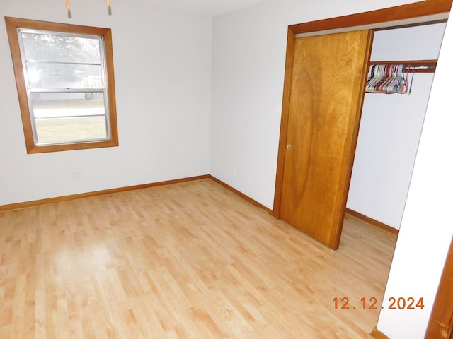 empty room with light wood-type flooring