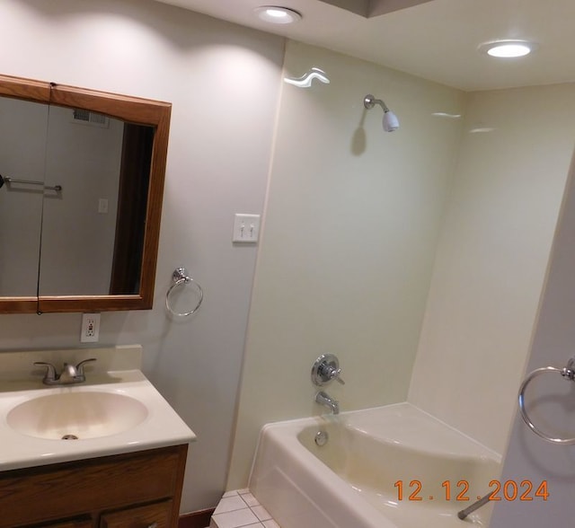 bathroom featuring vanity, bathtub / shower combination, and tile patterned floors