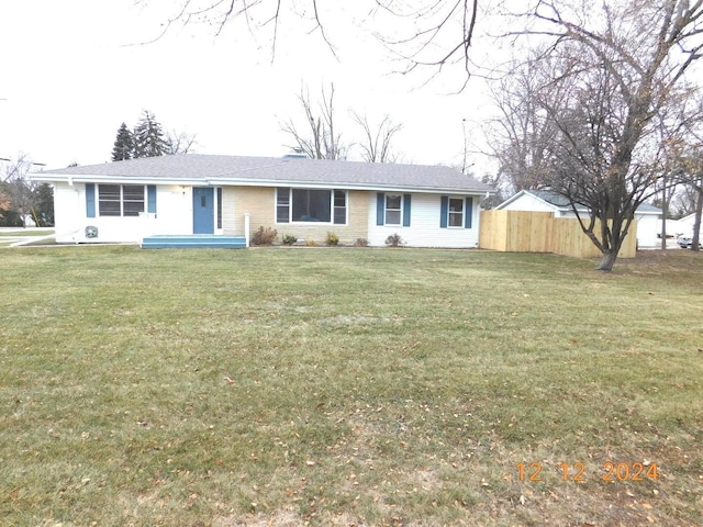 ranch-style home with a front yard