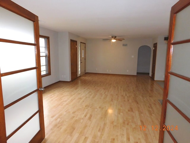 spare room with ceiling fan and light hardwood / wood-style floors