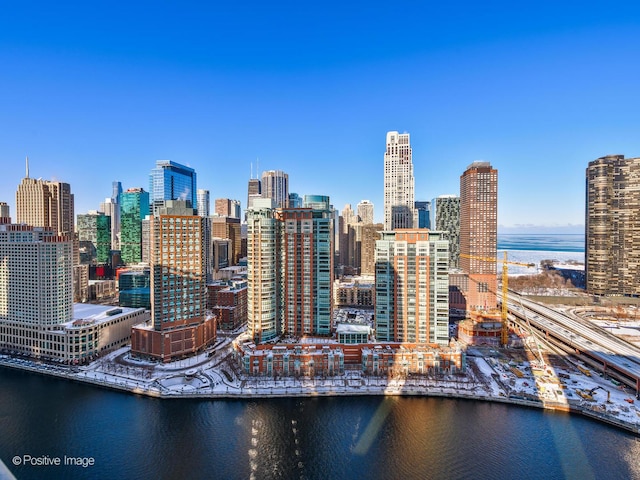 property's view of city with a water view