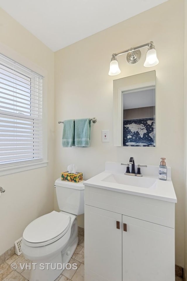 bathroom with vanity, tile patterned floors, and toilet