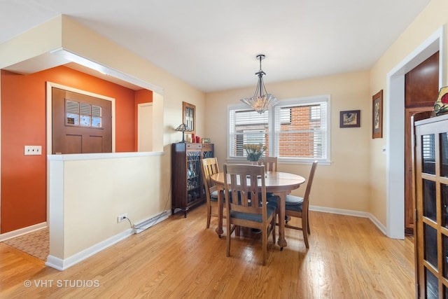 dining space with light hardwood / wood-style floors