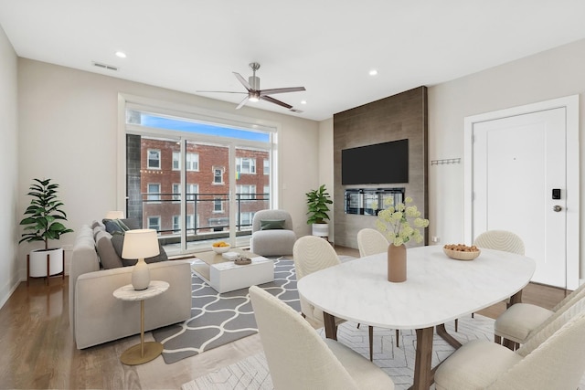 living room with ceiling fan and hardwood / wood-style floors