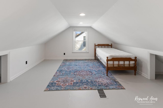 unfurnished bedroom with vaulted ceiling