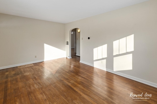 unfurnished room with hardwood / wood-style floors