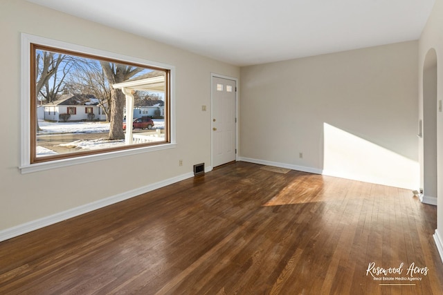 foyer entrance with dark hardwood / wood-style flooring