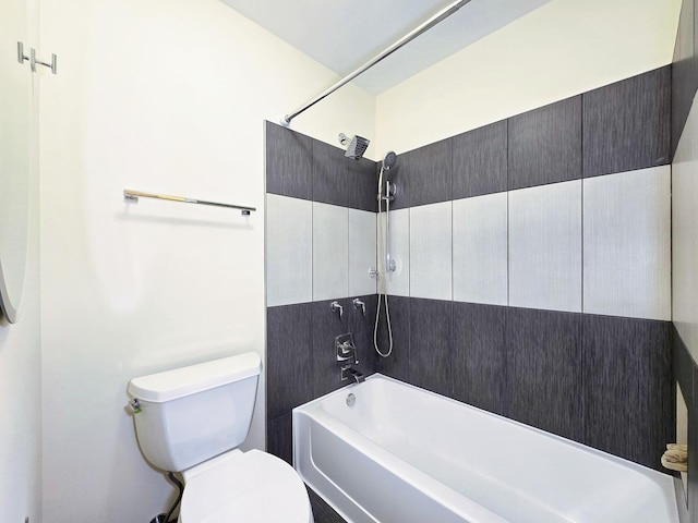 bathroom featuring shower / bathing tub combination and toilet