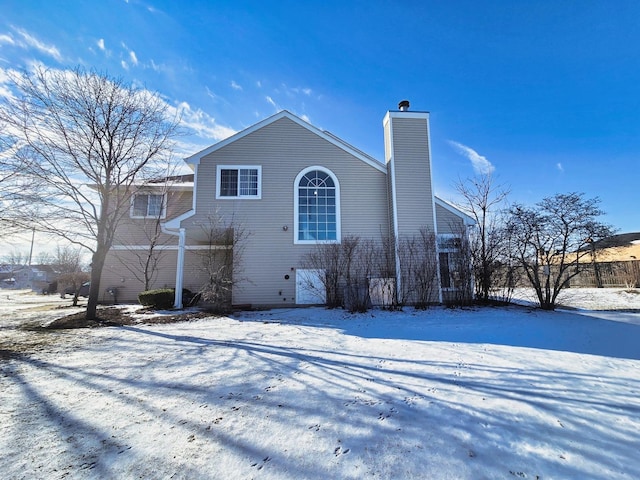 view of snow covered house