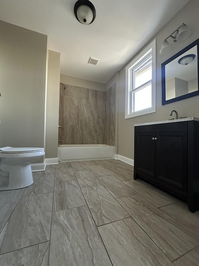 full bathroom featuring vanity,  shower combination, and toilet