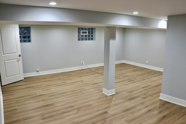 basement featuring light hardwood / wood-style flooring