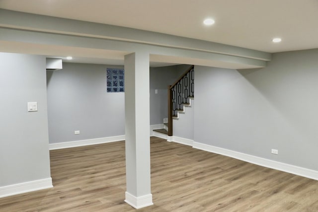 basement featuring light wood-type flooring