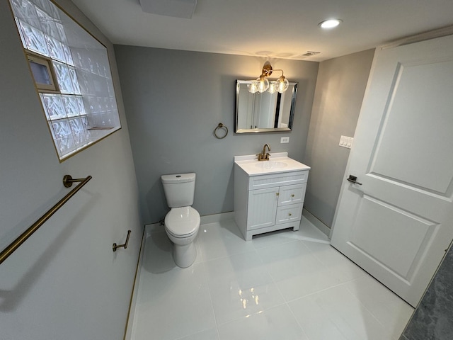 bathroom with toilet and vanity