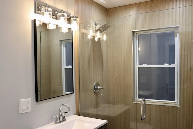 bathroom with an enclosed shower and vanity