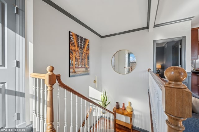 hallway featuring crown molding