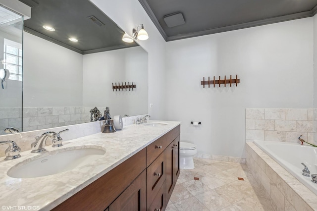 bathroom with tiled tub, ornamental molding, vanity, and toilet