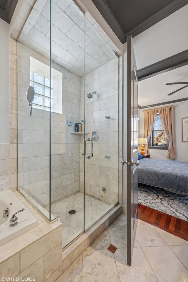 bathroom featuring crown molding and shower with separate bathtub