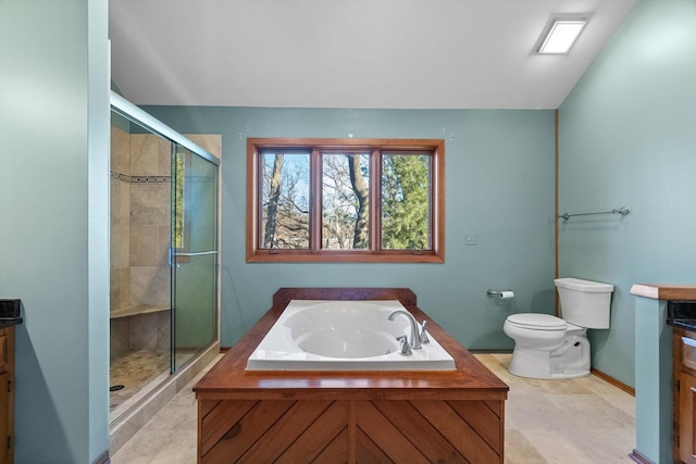 full bathroom with vanity, shower with separate bathtub, and toilet