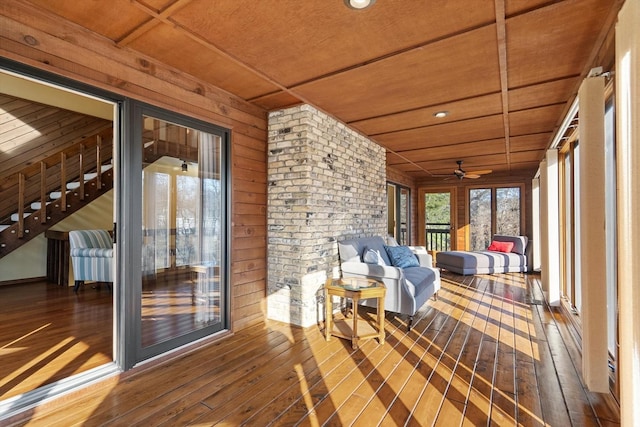 unfurnished sunroom with wood ceiling