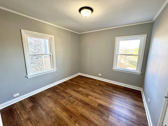 unfurnished room with dark wood-type flooring and crown molding