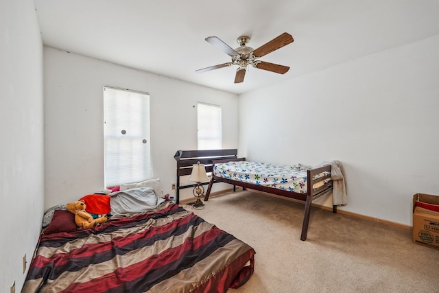 bedroom featuring ceiling fan and carpet flooring