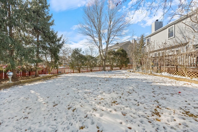 view of yard covered in snow