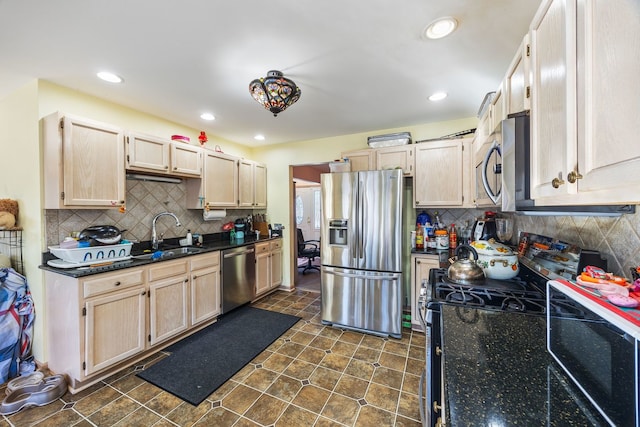 kitchen with light brown cabinetry, sink, decorative backsplash, and stainless steel appliances