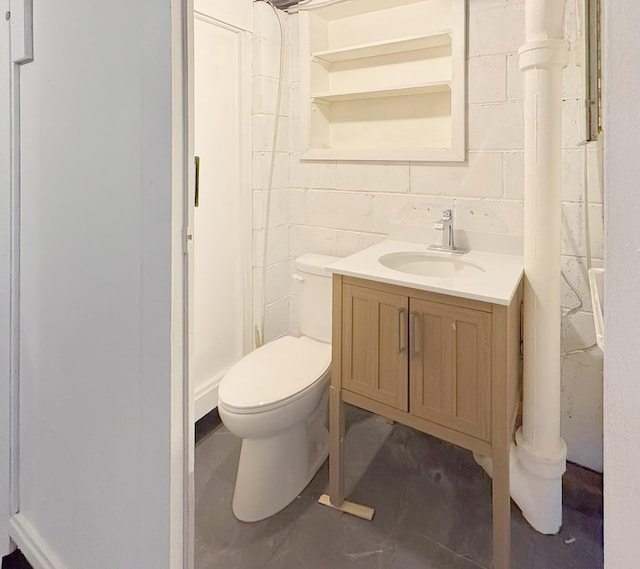 bathroom with toilet and vanity