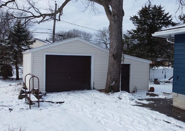 view of snow covered garage