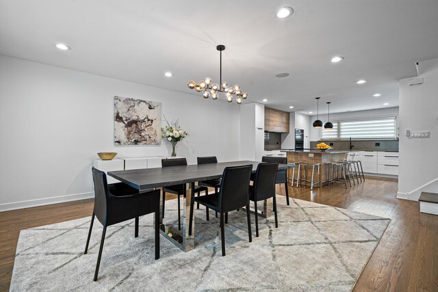 dining area with wood-type flooring