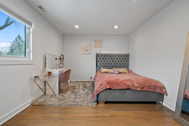 bedroom featuring hardwood / wood-style floors