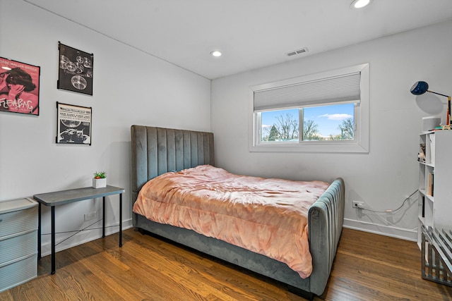 bedroom featuring dark hardwood / wood-style flooring