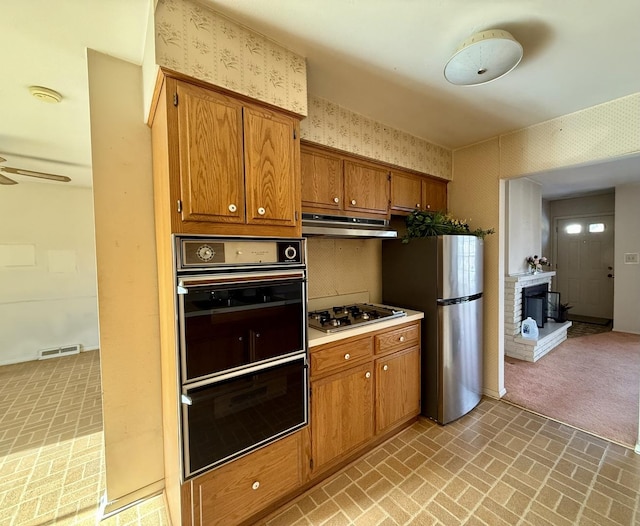 kitchen with ceiling fan and stainless steel appliances