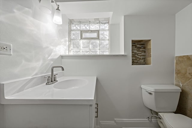 bathroom with toilet and vanity