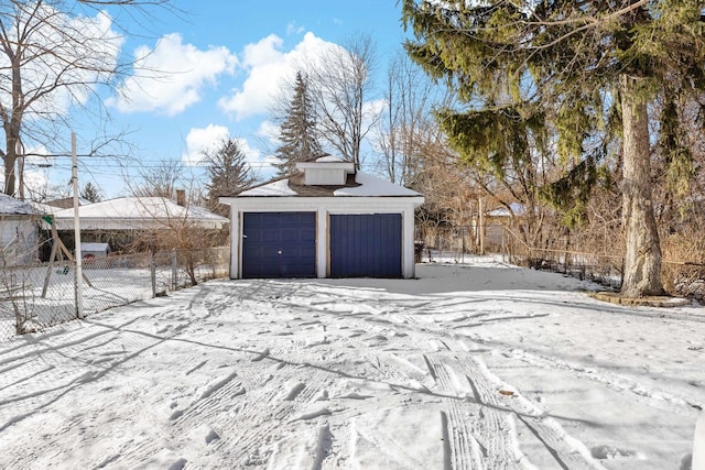 view of snow covered garage