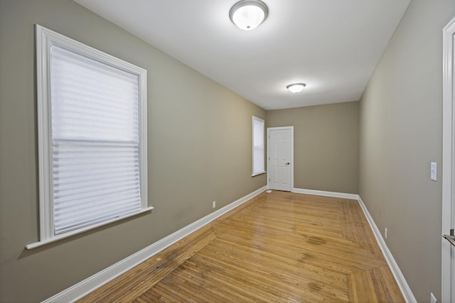 spare room featuring light wood-type flooring