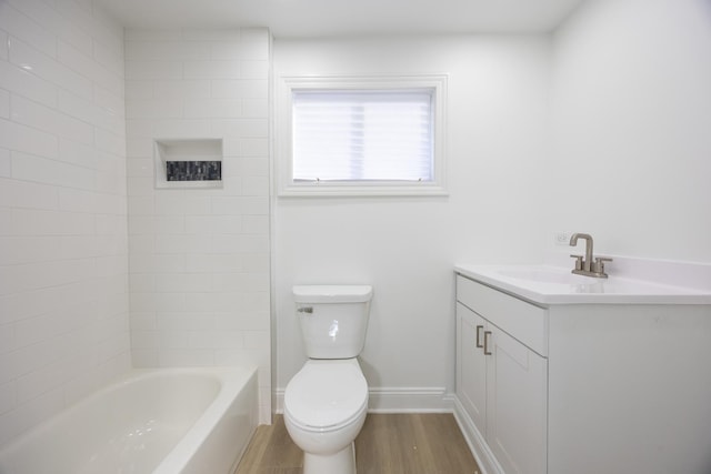 full bathroom with toilet,  shower combination, hardwood / wood-style flooring, and vanity