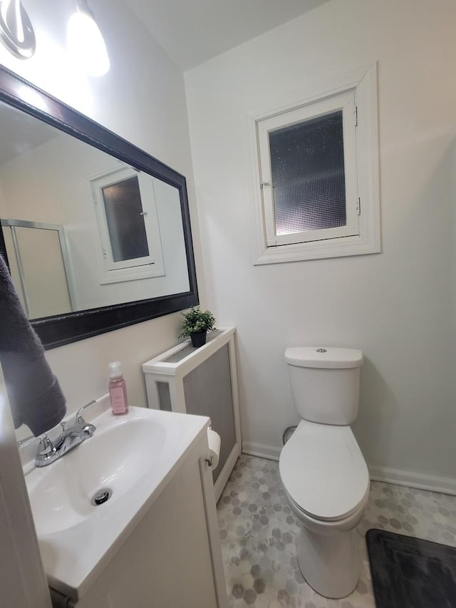 bathroom with toilet and vanity