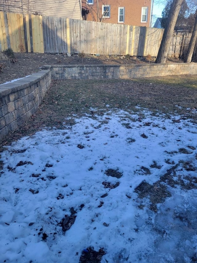 view of yard covered in snow