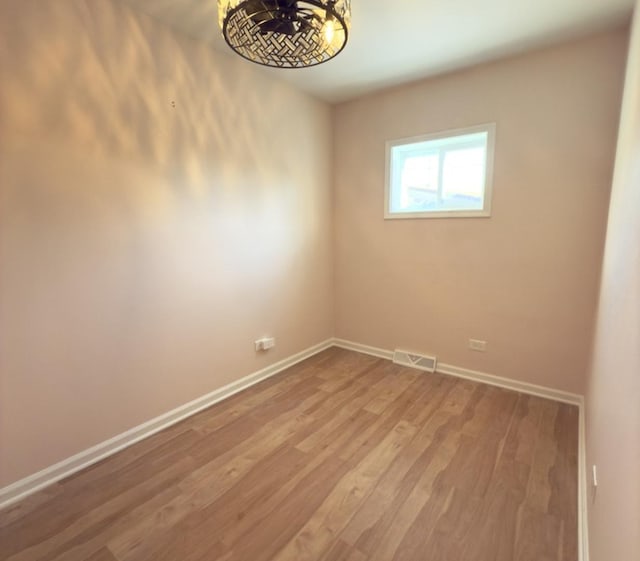 empty room featuring wood-type flooring