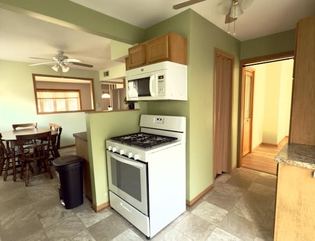 kitchen with ceiling fan and white appliances