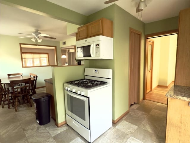 kitchen featuring ceiling fan and white appliances